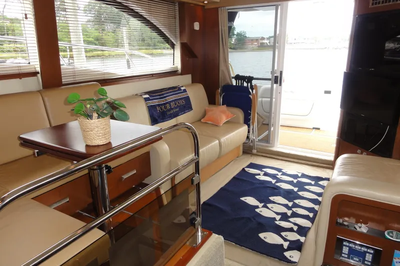  Yacht Photos Pics Luxurious interior of 2007 Sea Ray 36 Sedan Bridge yacht with elegant seating and decor.