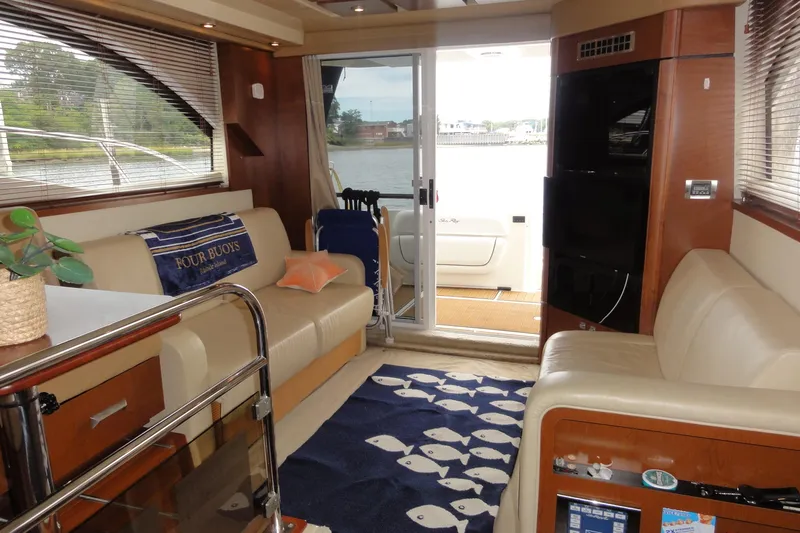  Yacht Photos Pics Interior of 2007 Sea Ray 36 Sedan Bridge yacht with cozy seating and nautical decor.