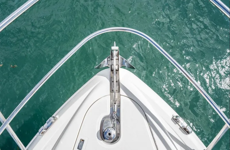 Parea Yacht Photos Pics Bow view of 2011 Azimut Atlantis 40 yacht on clear turquoise water.