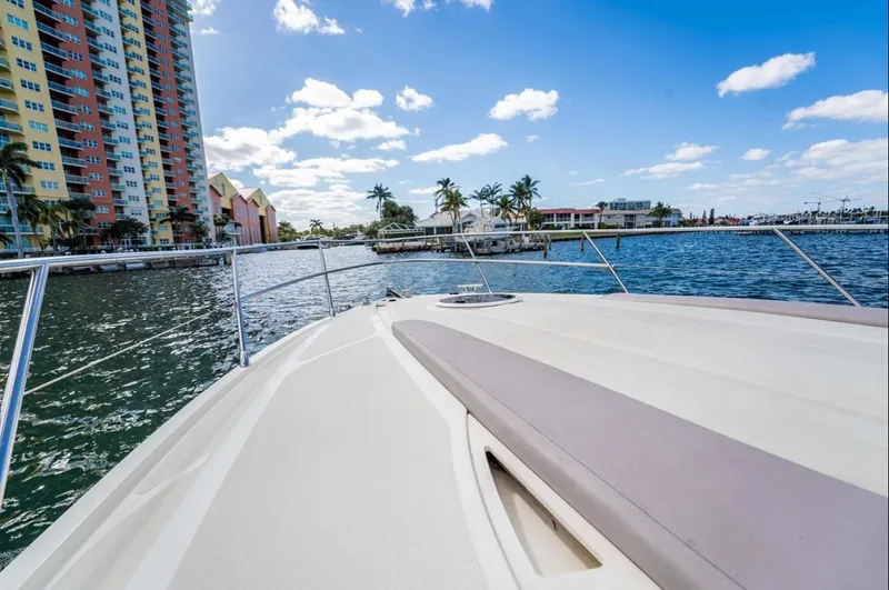 Parea Yacht Photos Pics Azimut Atlantis 40 yacht cruising near colorful waterfront buildings, 2011 model.