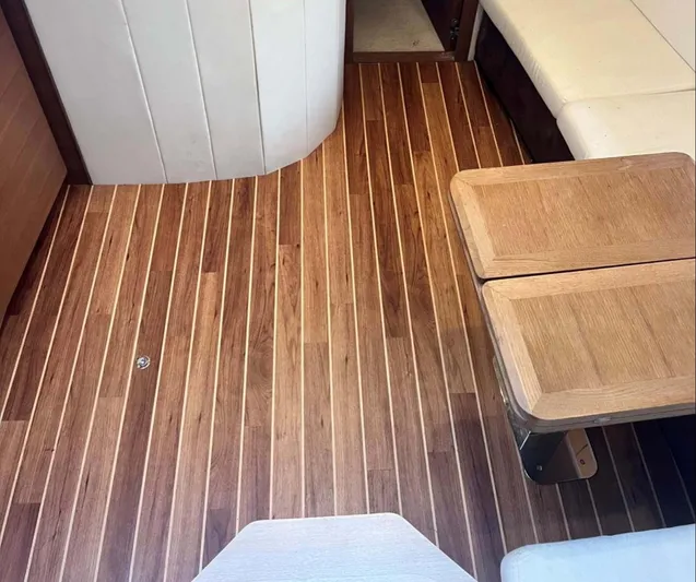Parea Yacht Photos Pics Interior of 2011 Azimut Atlantis 40 yacht with wooden flooring and seating area.