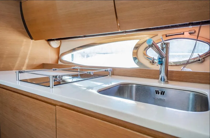 Parea Yacht Photos Pics Modern kitchen area in 2011 Azimut Atlantis 40 yacht with sink and window.