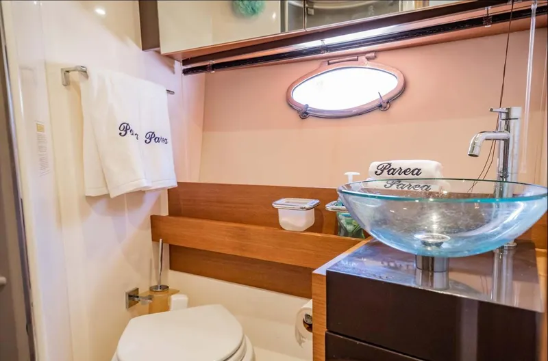 Parea Yacht Photos Pics Luxurious bathroom in 2011 Azimut Atlantis 40 yacht with glass sink and elegant decor.