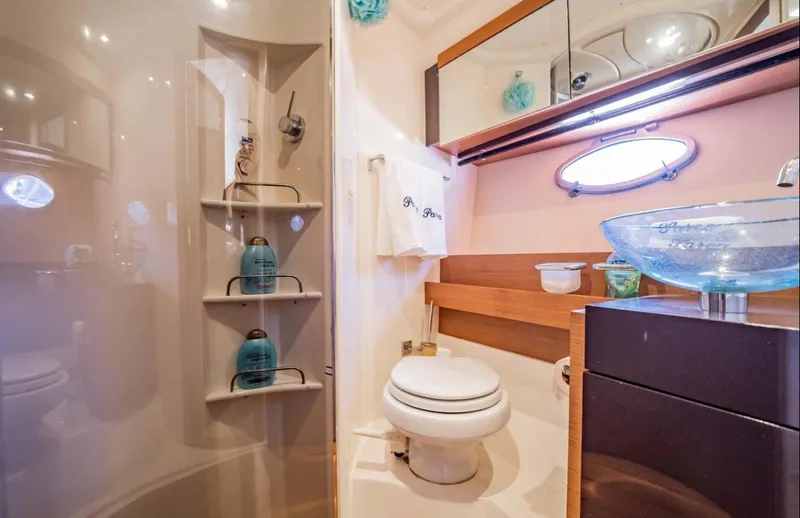 Parea Yacht Photos Pics Luxurious bathroom in 2011 Azimut Atlantis 40 yacht with modern fixtures and elegant design.