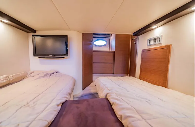 Parea Yacht Photos Pics Interior cabin of 2011 Azimut Atlantis 40 yacht with twin beds and TV.