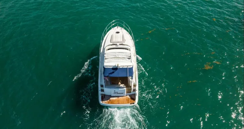 Parea Yacht Photos Pics Aerial view of 2011 Azimut Atlantis 40 yacht cruising on clear blue water.