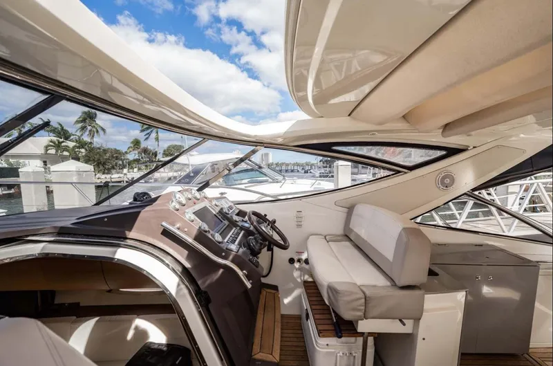 Parea Yacht Photos Pics Interior view of 2011 Azimut Atlantis 40 yacht with helm and seating area.