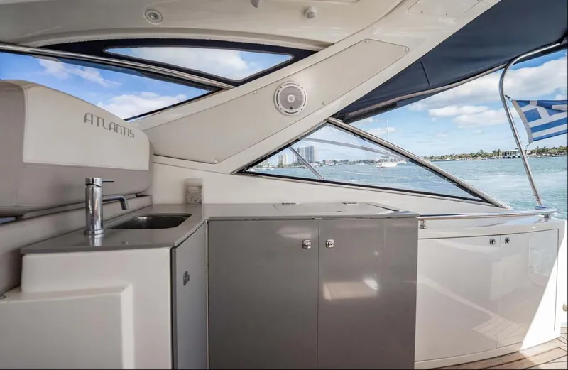 Parea Yacht Photos Pics Interior view of 2011 Azimut Atlantis 40 yacht with sleek cabinetry and ocean backdrop.