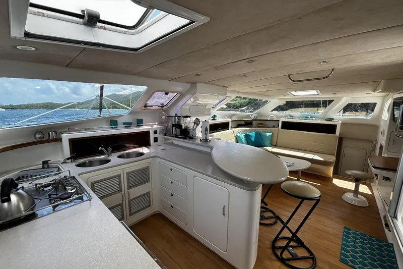 Windborne Yacht Photos Pics Luxurious interior with modern kitchen and seating area.