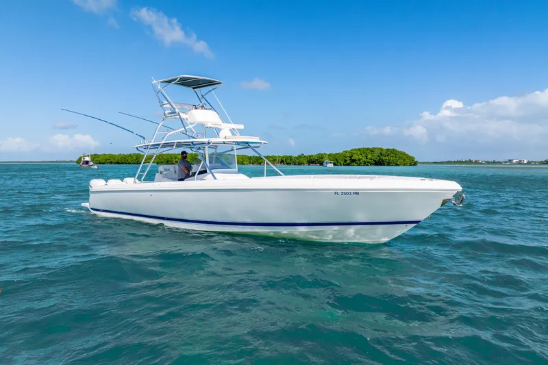  Yacht Photos Pics 2016 Intrepid 400 Center Console boat cruising on clear blue waters.