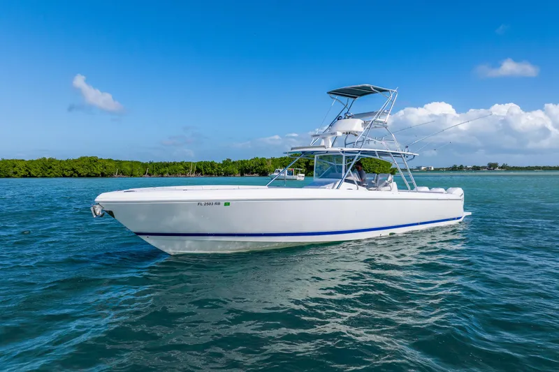  Yacht Photos Pics 2016 Intrepid 400 Center Console boat on clear blue water under a sunny sky.