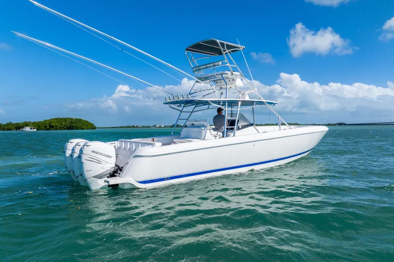  Yacht Photos Pics 2016 Intrepid 400 Center Console boat cruising on clear blue water.