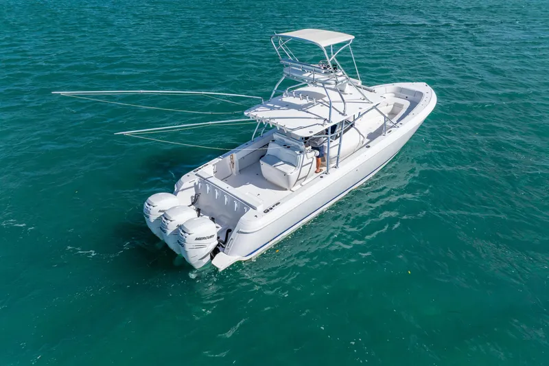  Yacht Photos Pics 2016 Intrepid 400 Center Console boat on clear blue water.