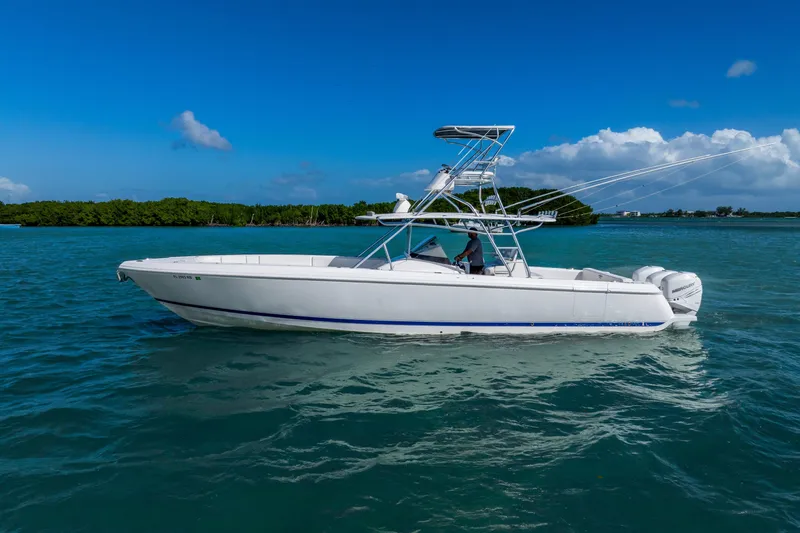  Yacht Photos Pics 2016 Intrepid 400 Center Console boat cruising on clear blue water.