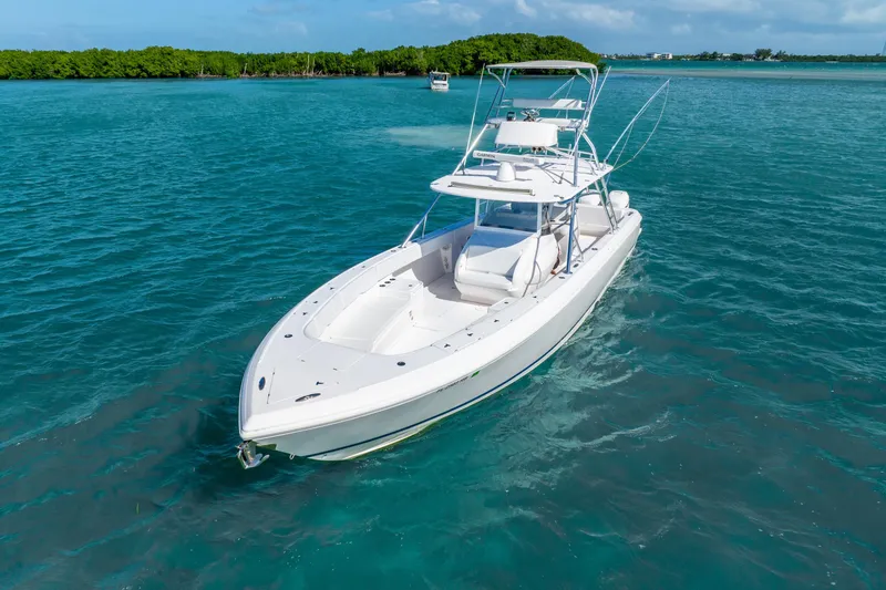 Yacht Photos Pics 2016 Intrepid 400 Center Console boat cruising on clear blue water.