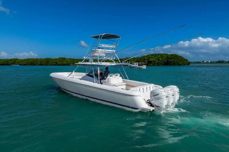  Yacht Photos Pics 2016 Intrepid 400 Center Console boat cruising on clear blue water.