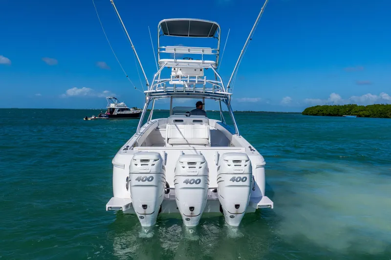  Yacht Photos Pics 2016 Intrepid 400 Center Console boat with triple engines on open water.