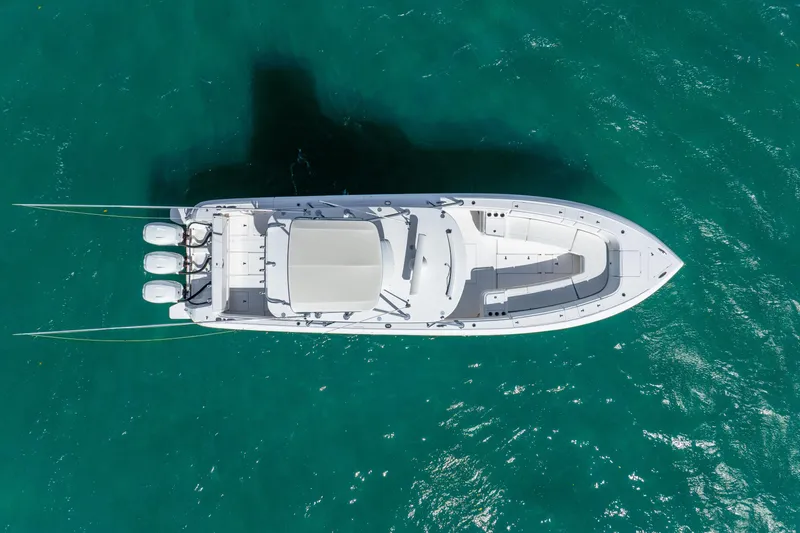  Yacht Photos Pics Overhead view of 2016 Intrepid 400 Center Console boat on turquoise water.