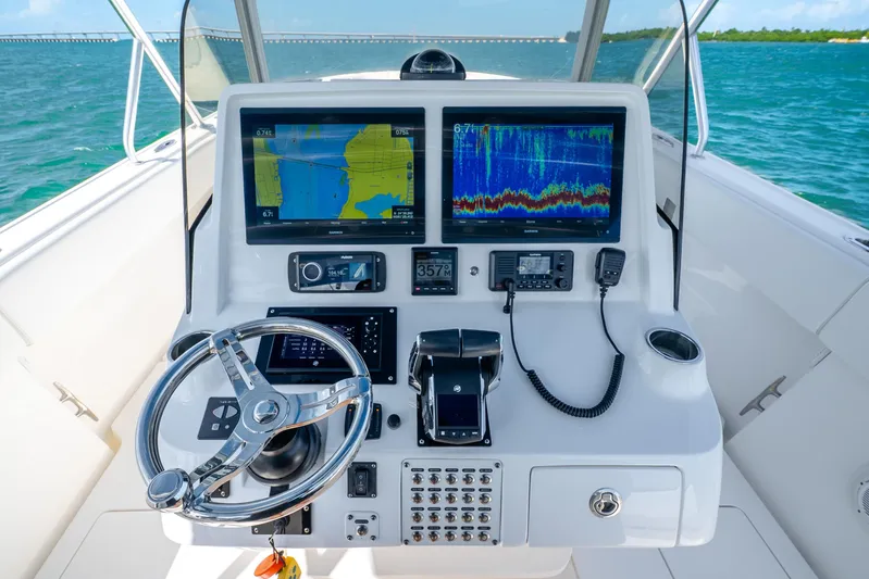  Yacht Photos Pics 2016 Intrepid 400 Center Console helm with advanced navigation displays and controls.