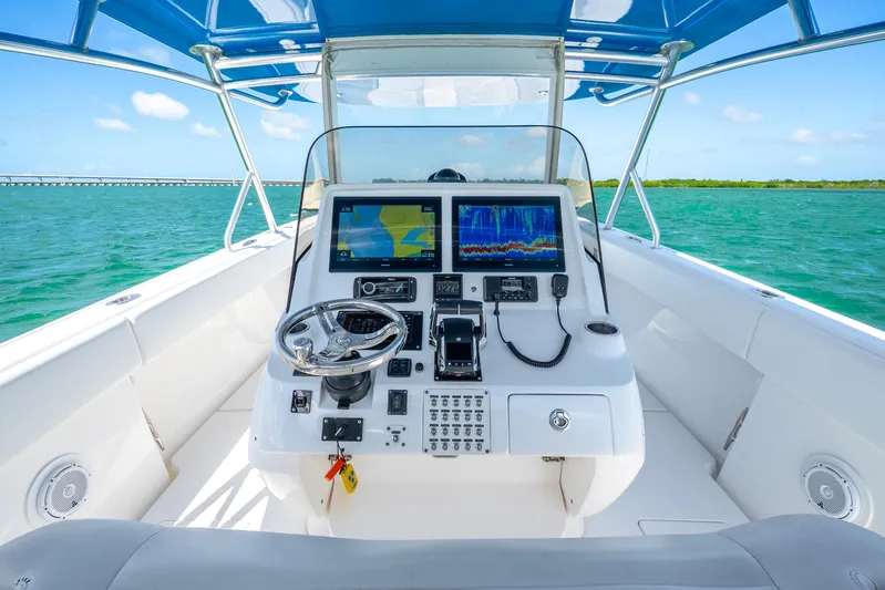  Yacht Photos Pics 2016 Intrepid 400 Center Console boat dashboard with navigation screens on open water.