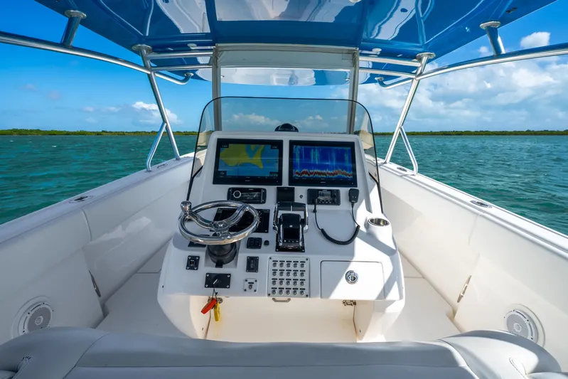  Yacht Photos Pics 2016 Intrepid 400 Center Console boat dashboard with navigation screens on open water.