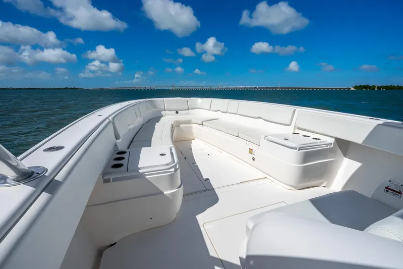  Yacht Photos Pics 2016 Intrepid 400 Center Console boat interior with spacious seating, under a clear blue sky.