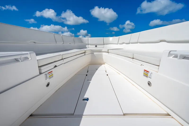  Yacht Photos Pics 2016 Intrepid 400 Center Console boat interior with white seating under a blue sky.