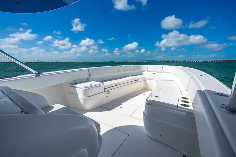  Yacht Photos Pics 2016 Intrepid 400 Center Console boat with spacious seating, under a clear blue sky.