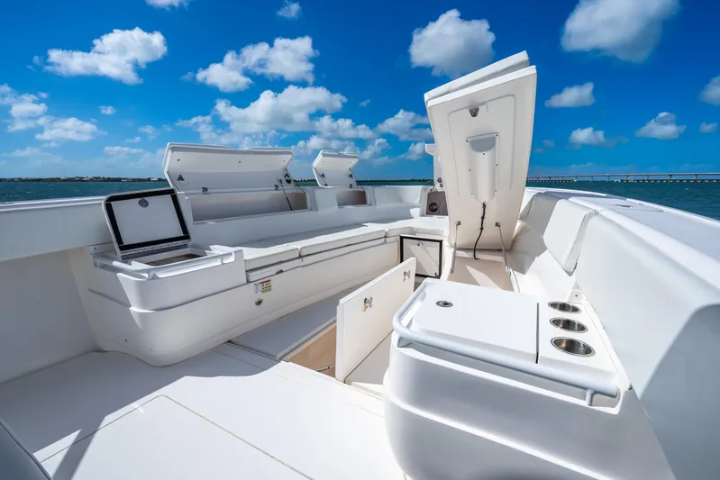  Yacht Photos Pics 2016 Intrepid 400 Center Console boat interior with open storage compartments under a clear blue sky.