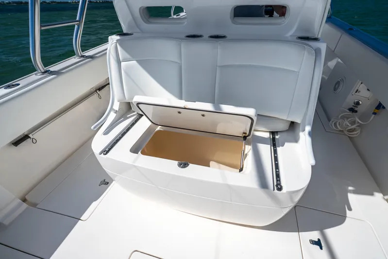  Yacht Photos Pics 2016 Intrepid 400 Center Console boat with open storage compartment and white seating.