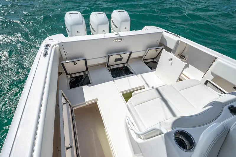  Yacht Photos Pics 2016 Intrepid 400 Center Console boat with open storage compartments on deck.