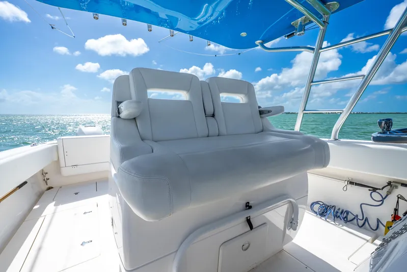  Yacht Photos Pics 2016 Intrepid 400 Center Console boat interior with white seating, ocean view, and blue sky.