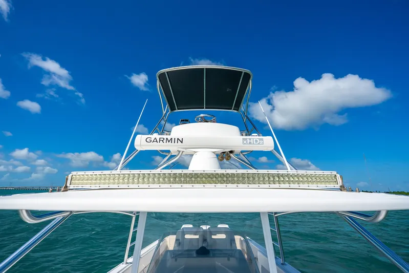  Yacht Photos Pics 2016 Intrepid 400 Center Console boat with Garmin equipment on open water under blue sky.