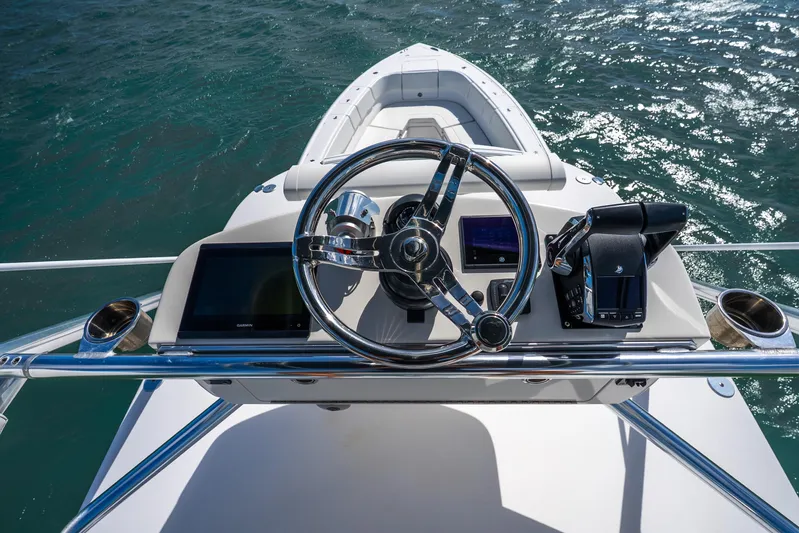  Yacht Photos Pics 2016 Intrepid 400 Center Console helm with steering wheel and navigation screens.