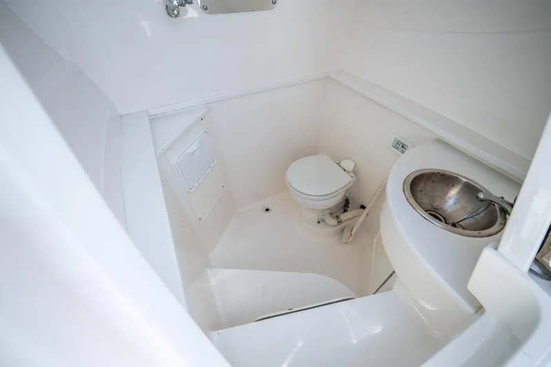  Yacht Photos Pics 2016 Intrepid 400 Center Console boat bathroom with toilet and sink.