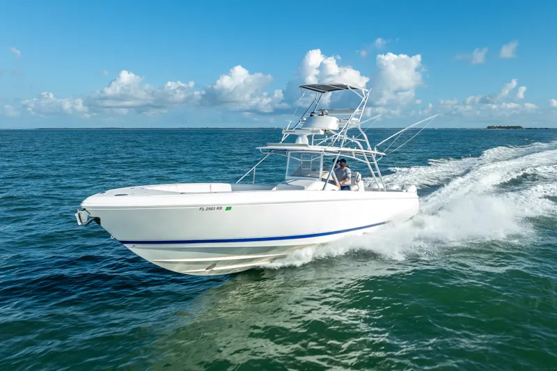  Yacht Photos Pics 2016 Intrepid 400 Center Console boat cruising on open water under blue skies.