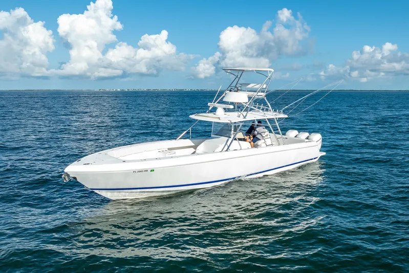  Yacht Photos Pics 2016 Intrepid 400 Center Console boat cruising on open water under blue skies.