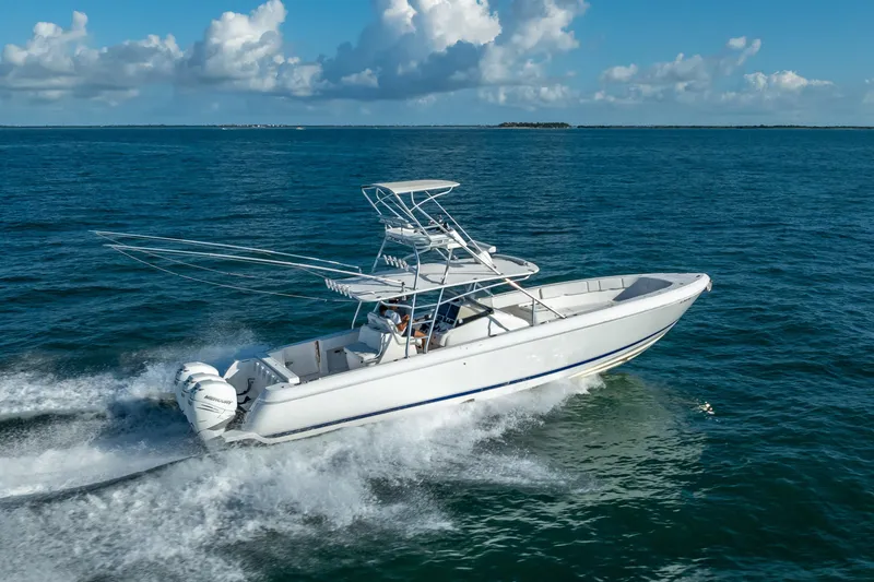  Yacht Photos Pics 2016 Intrepid 400 Center Console boat cruising on open water under a clear sky.