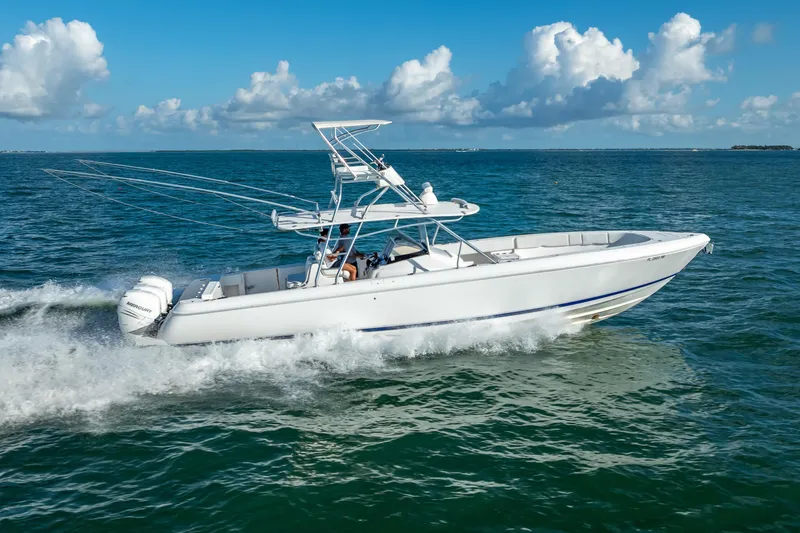  Yacht Photos Pics 2016 Intrepid 400 Center Console boat cruising on open water under a clear sky.