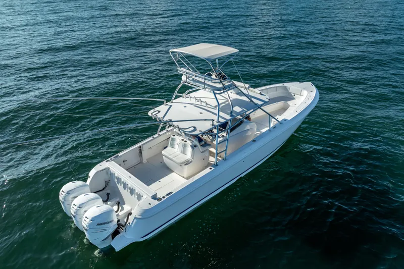  Yacht Photos Pics 2016 Intrepid 400 Center Console boat on open water, featuring triple outboard engines.