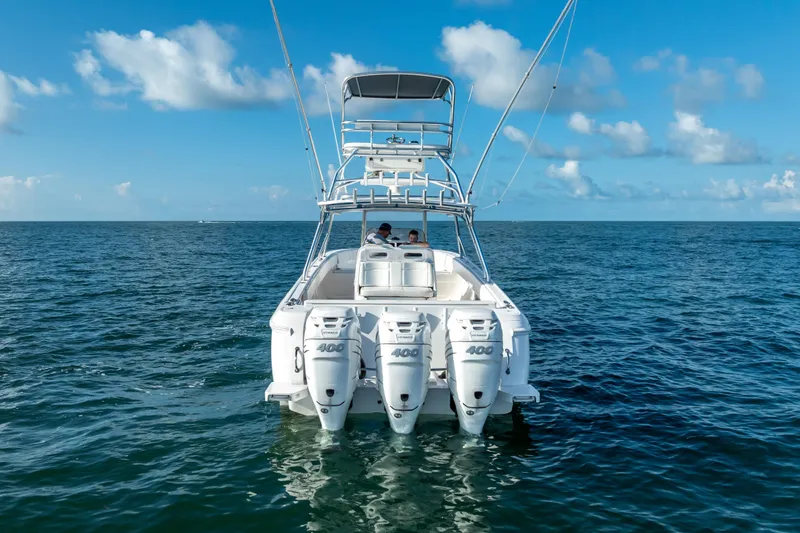  Yacht Photos Pics 2016 Intrepid 400 Center Console boat with triple engines on open sea.