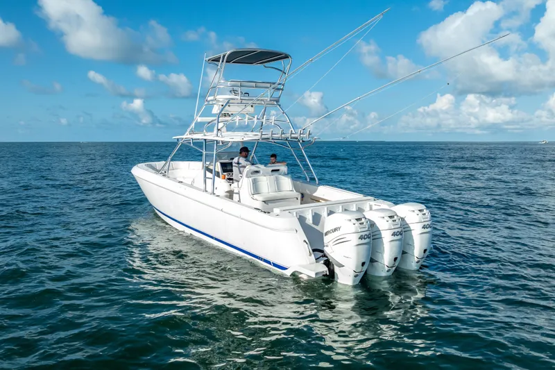  Yacht Photos Pics 2016 Intrepid 400 Center Console boat on open sea with triple Mercury engines.