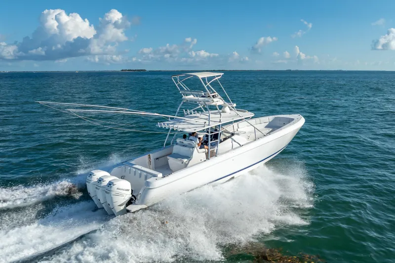  Yacht Photos Pics 2016 Intrepid 400 Center Console boat cruising on open water under clear skies.