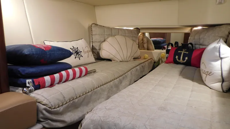  Yacht Photos Pics Interior of 2007 Sea Ray 36 Sedan Bridge with nautical-themed bedding and decor.