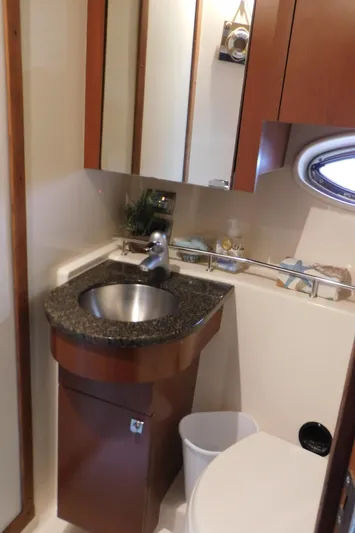  Yacht Photos Pics 2007 Sea Ray 36 Sedan Bridge bathroom with sink, mirror, and porthole window.