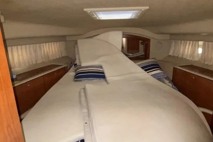 Gazoo Yacht Photos Pics Interior cabin of 2001 Sea Ray 400 Sedan Bridge with bed and storage cabinets.