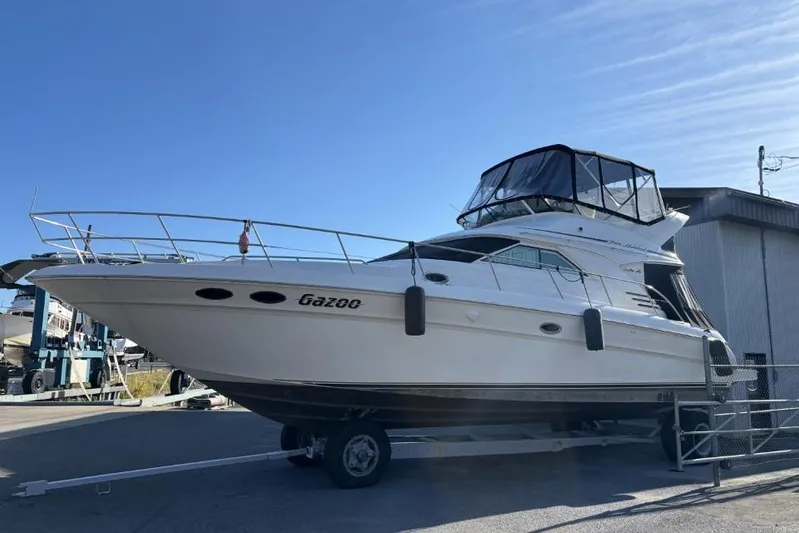 Gazoo Yacht Photos Pics 2001 Sea Ray 400 Sedan Bridge yacht on trailer, docked outdoors.