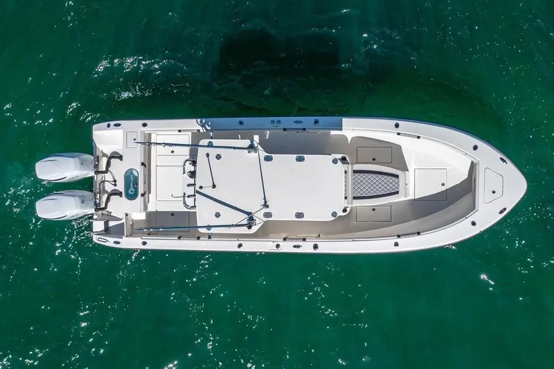  Yacht Photos Pics Top view of 2021 Sea-Lion 27 CC boat on clear green water.