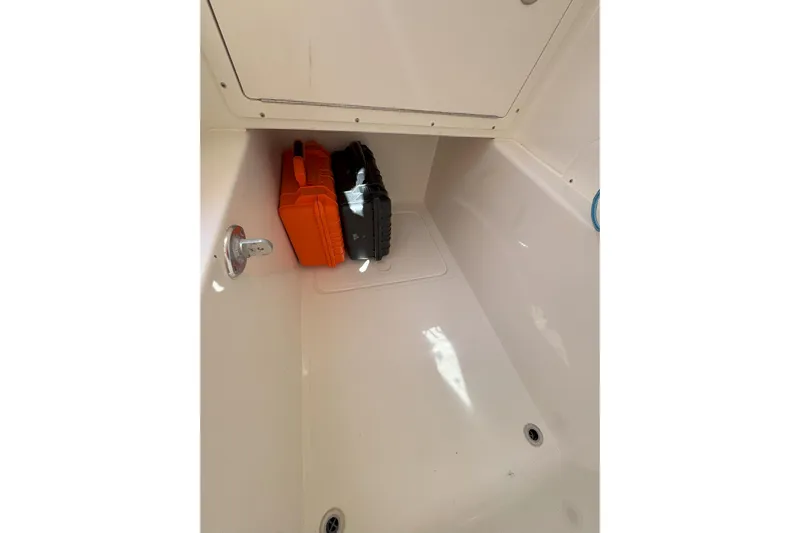  Yacht Photos Pics Storage compartment of 2021 Sea-Lion 27 CC boat with orange and black cases.