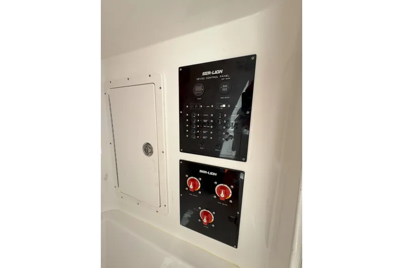 Yacht Photos Pics Control panel of 2021 Sea-Lion 27 CC boat with switches and dials.